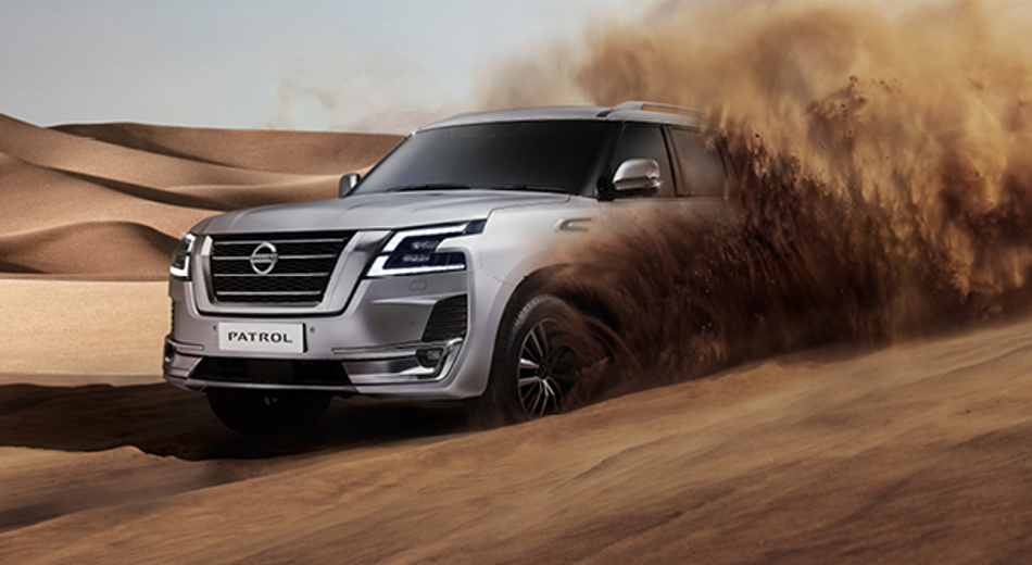 Patrol driving in sand dunes